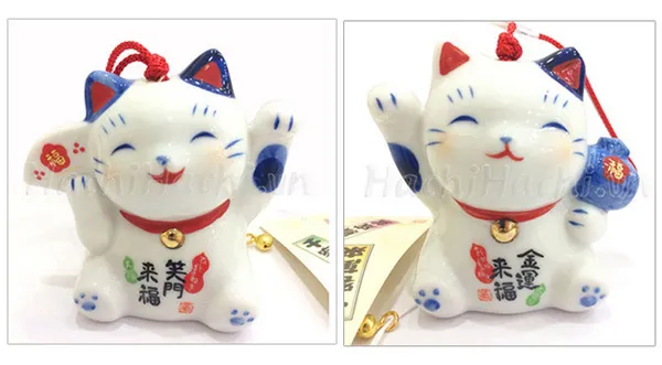 Hình ảnh mèo Maneki Neko cầm quạt và trống trong các dịp lễ hội